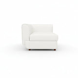 A white Rituals sofa corner unit with a cushioned backrest and seat, set against a plain background.